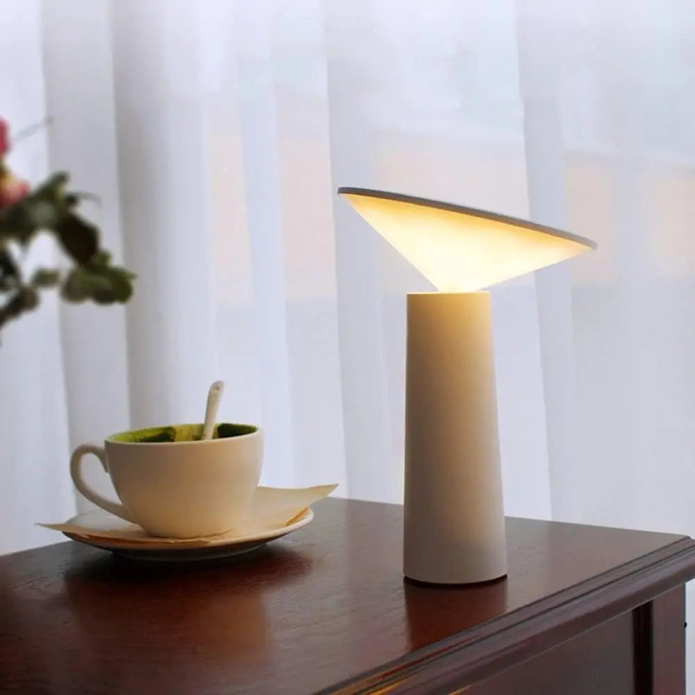 FlexiGlow lamp with its arm fully adjusted to direct light downward.