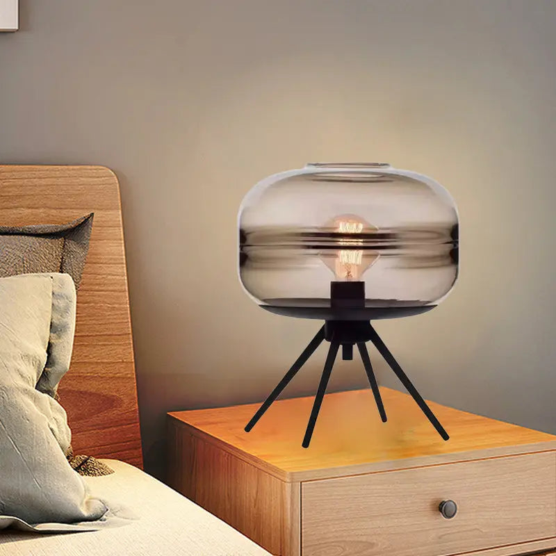 QuadraLight lamp on a bedside table, enhancing bedroom decor with modern flair