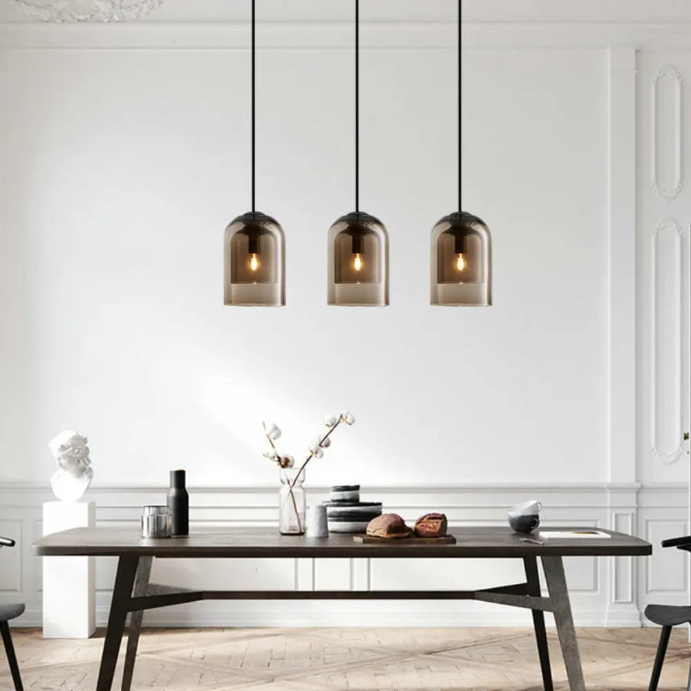 AirGlass pendant light providing focused light above a sleek modern desk setup.