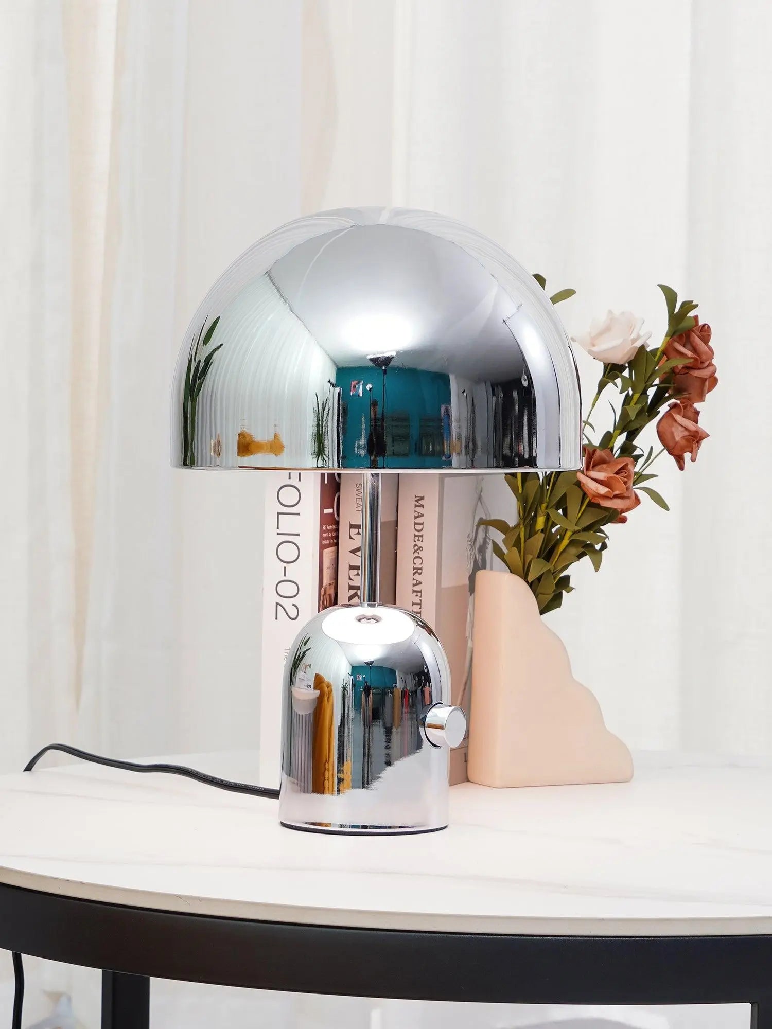 Elegant BellaGlow bell-shaped table lamp in chrome finish, perfect for adding soft ambient lighting to any space.