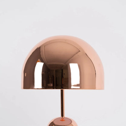 Elegant BellaGlow bell-shaped table lamp in rose gold, adding a touch of sophistication to interior decor.