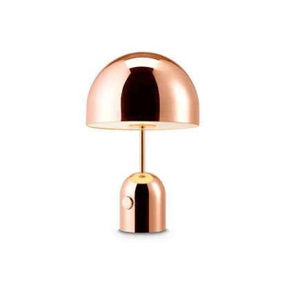 Rose gold BellaGlow table lamp with a bell silhouette, adding a warm and cozy glow to the decor.