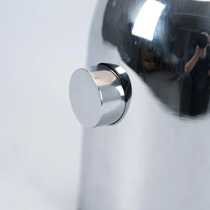 Close-up of BellaGlow table lamp in chrome finish, emphasizing the lamp’s refined design and smooth texture - button.