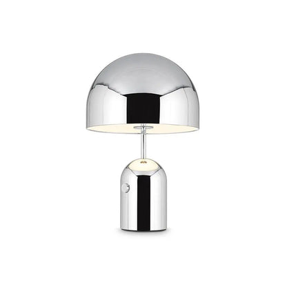 Chrome BellaGlow bell-shaped table lamp illuminated, casting a soft LED glow for cozy ambient lighting.