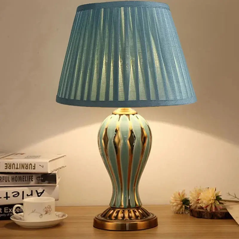 The CeramiGlow lamp featuring a timeless light blue finish that complements various room decors.