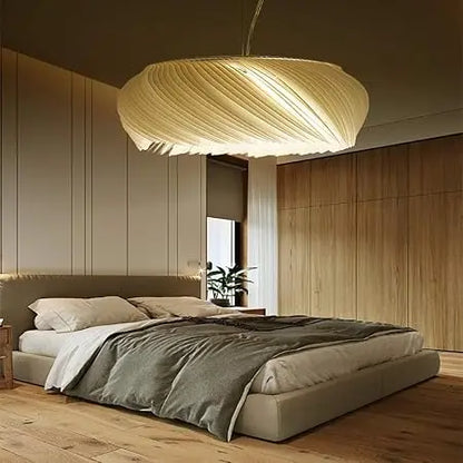 ClearGlow ceiling light providing soft, adjustable lighting for a cozy, modern bedroom setting.