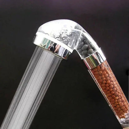 Front view of EcoFlow shower head, showing the wide spray surface.