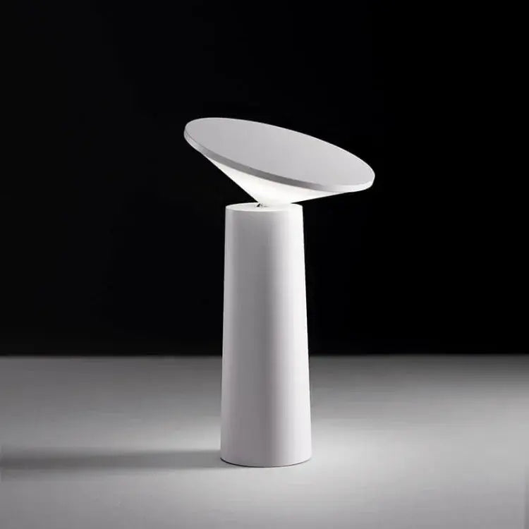 FlexiGlow lamp with its arm fully adjusted to direct light downward.
