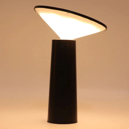 FlexiGlow lamp with its arm fully adjusted to direct light downward.