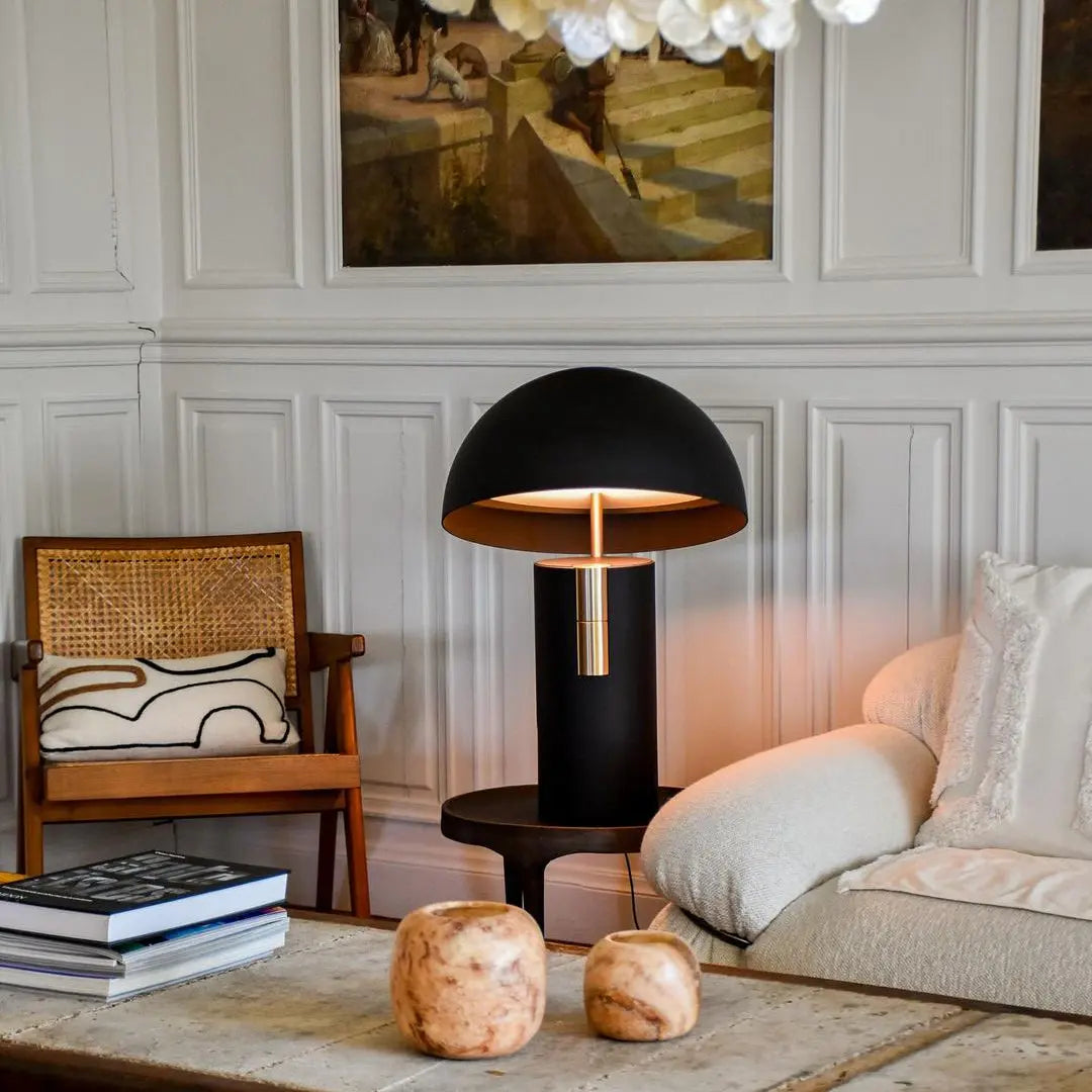 GlowAura table lamp providing soft light in a cozy living room with warm-toned decor.