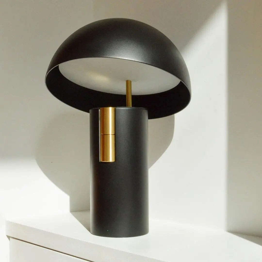 The GlowAura lamp on display during daylight, showing its neutral design appeal.