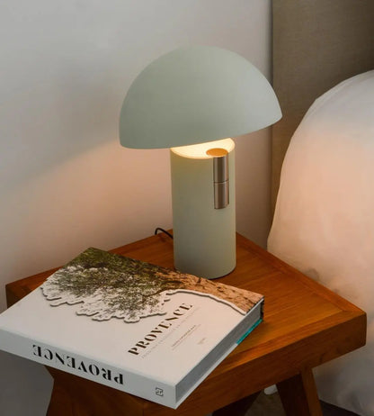 GlowAura lamp adding warmth to a cozy reading nook with soft, inviting light.