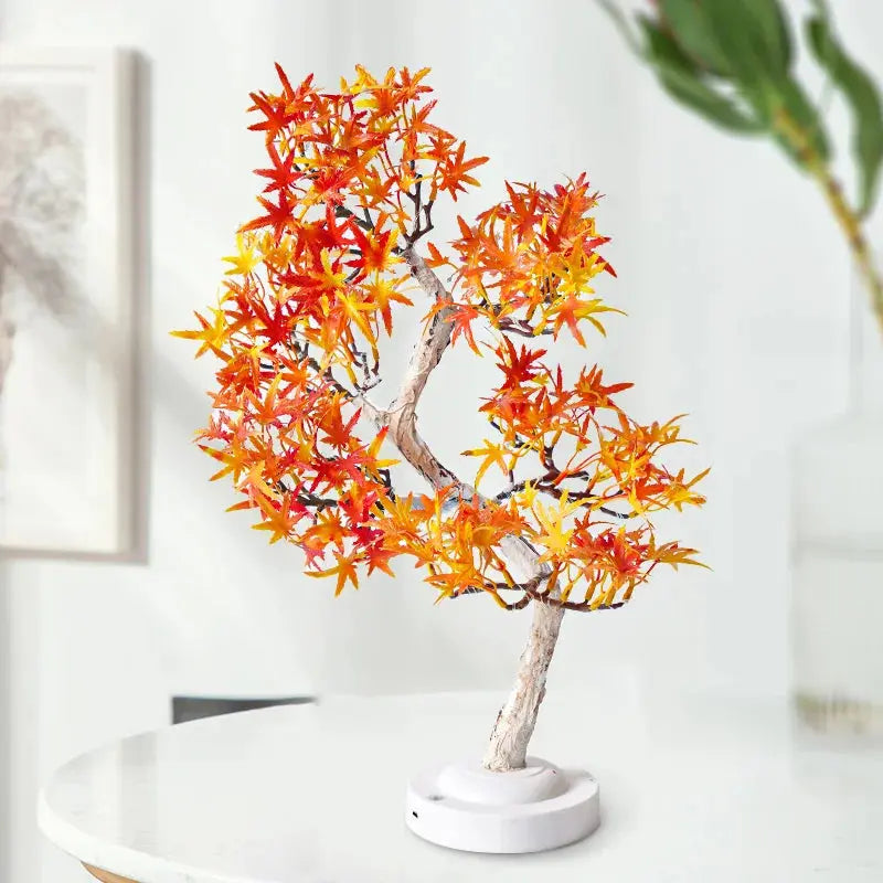 Close-up of the realistic maple leaves illuminated by the soft LED lights on the MapleBliss lamp.