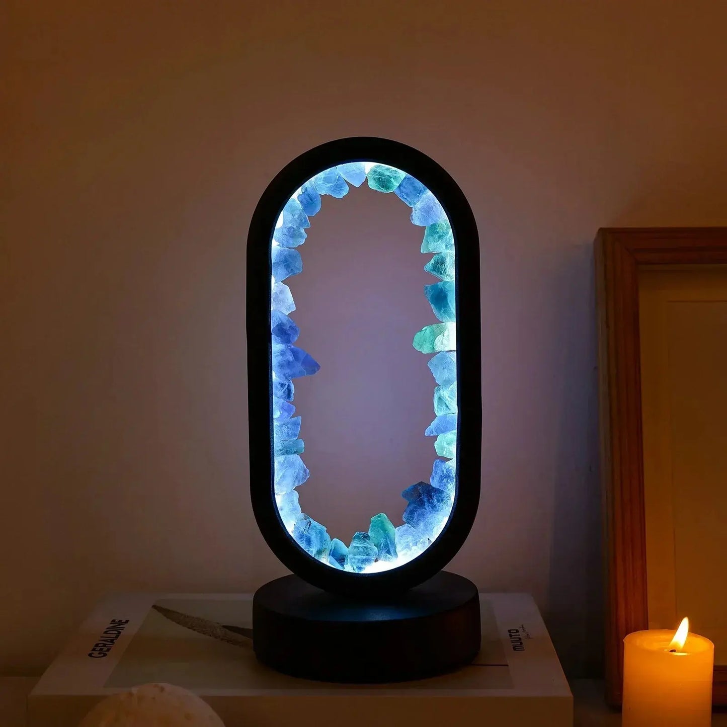 SerenityStone lamp glowing softly, creating a calming ambiance in a darkened room.