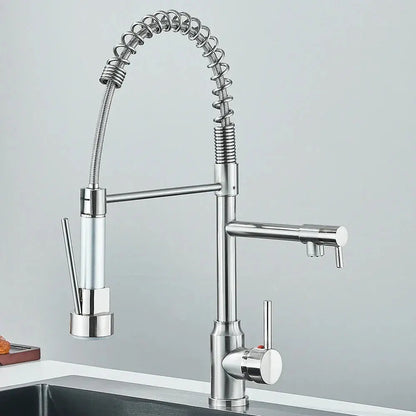 Sleek TwinStream dual-spout kitchen mixer faucet in a shiny chrome finish, shown installed in a modern kitchen sink.