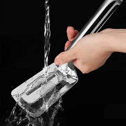 FlipMaster multi-use cooking spatula easy cleaning with running water.