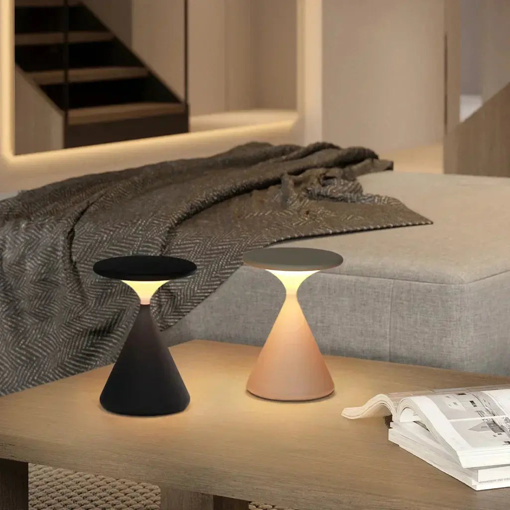 GlowSphere cordless lamp placed on a bedside table, providing soft and soothing light perfect for evening relaxation.