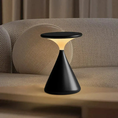 GlowSphere cordless hourglass lamp placed in a living room, adding a touch of modern elegance to the space.