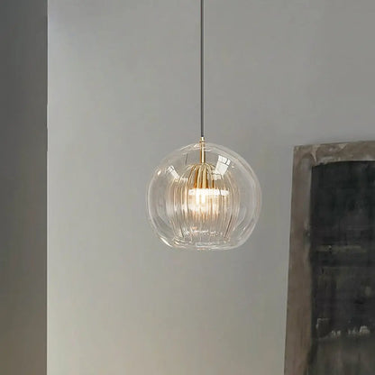 LumiaAmber pendant light with amber bulb on, creating a soft ambient glow