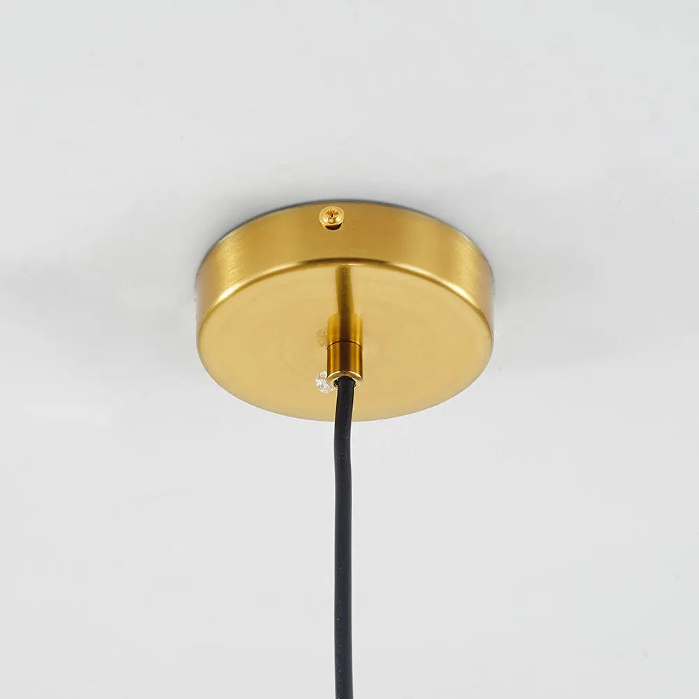 Close-up of brass hardware on the LumiaAmber pendant light with a smooth finish - 2