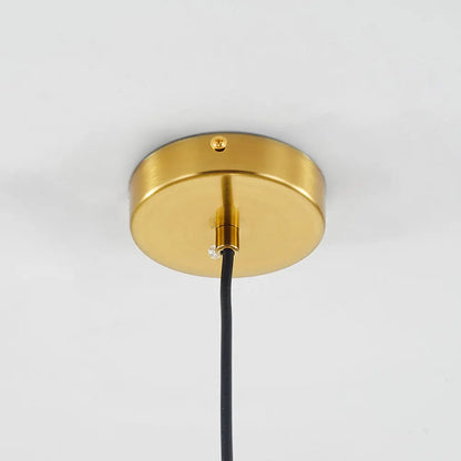 Close-up of brass hardware on the LumiaAmber pendant light with a smooth finish - 2