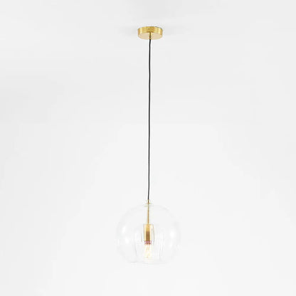 Close-up of brass hardware on the LumiaAmber pendant light with a smooth finish