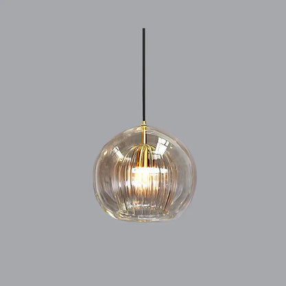 Close-up of LumiaAmber pendant light in a stylish interior scene