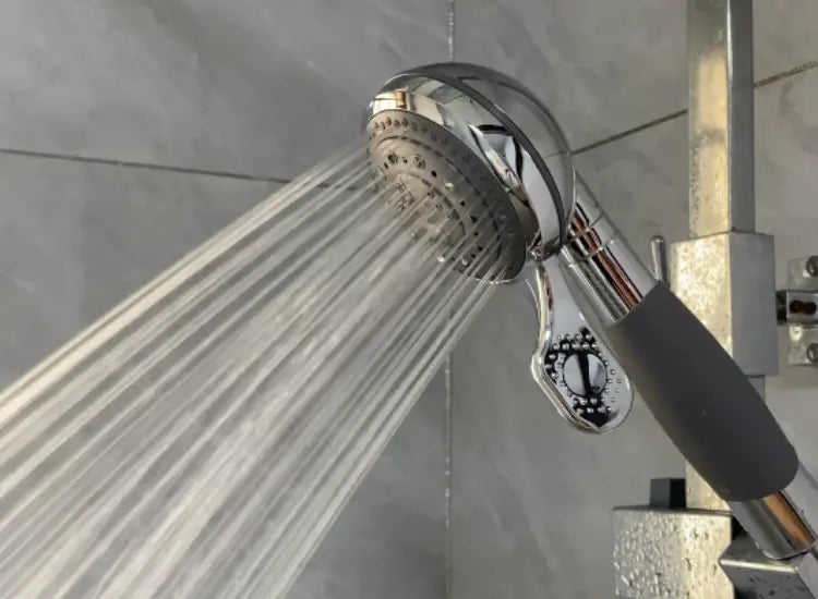 Adjustable water pressure feature on SafeWash shower head, allowing customized shower experience.