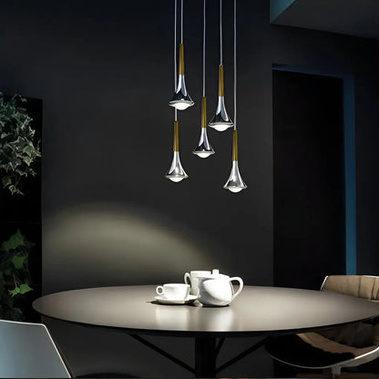 ScandiDrop pendant light displayed above a table, offering a cozy ambiance ideal for dining or gathering spaces.