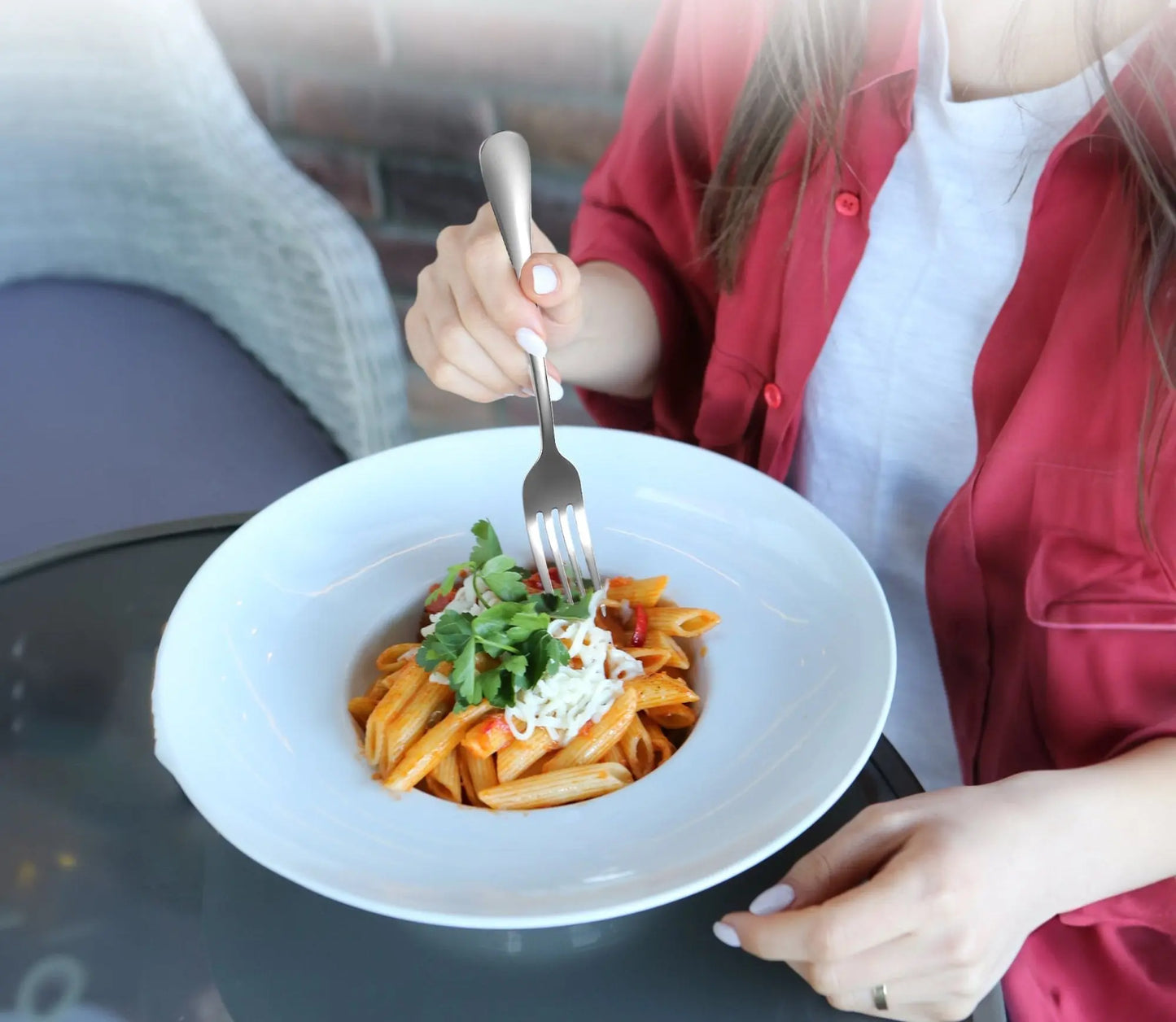 SilverGleam tableware set displayed with food items, showing the practical and stylish use of the set during meals.