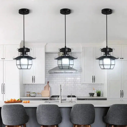 VintageCage pendant light hanging in a dining room, adding warm and rustic lighting