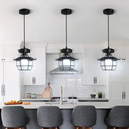 VintageCage pendant light hanging over a kitchen island for an industrial look - 2