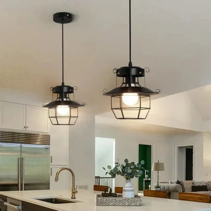 VintageCage pendant light hanging over a kitchen island for an industrial look